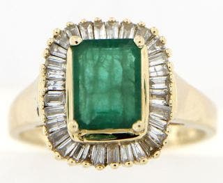 PRE OWNED 14 KARAT YELLOW GOLD EMERALD AND DIAMOND RING