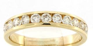 PRE-OWNED 18 KARAT YELLOW GOLD CHANNEL SET DIAMOND BAND